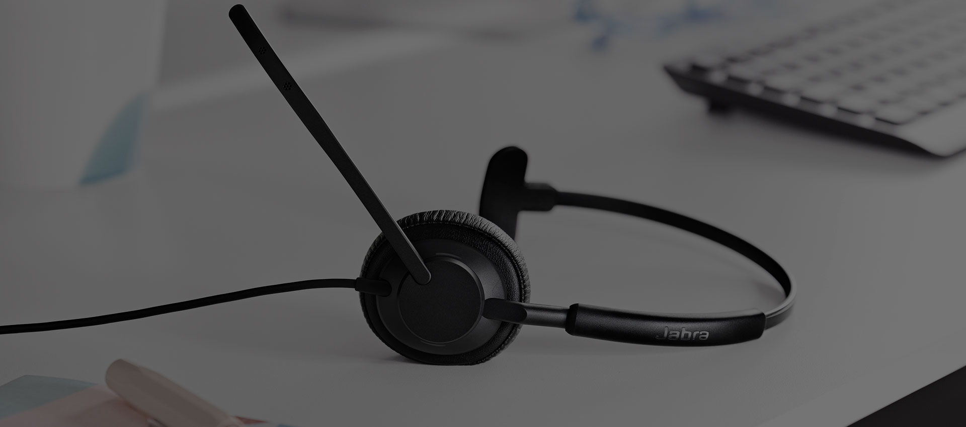 A headset lay on the desk